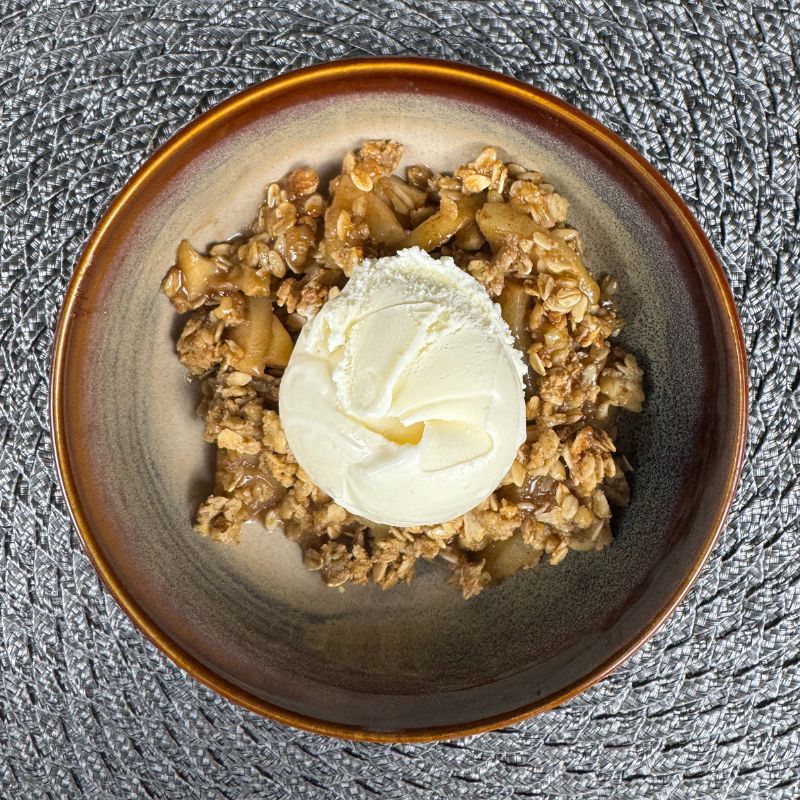 Apple crisp with ice cream.