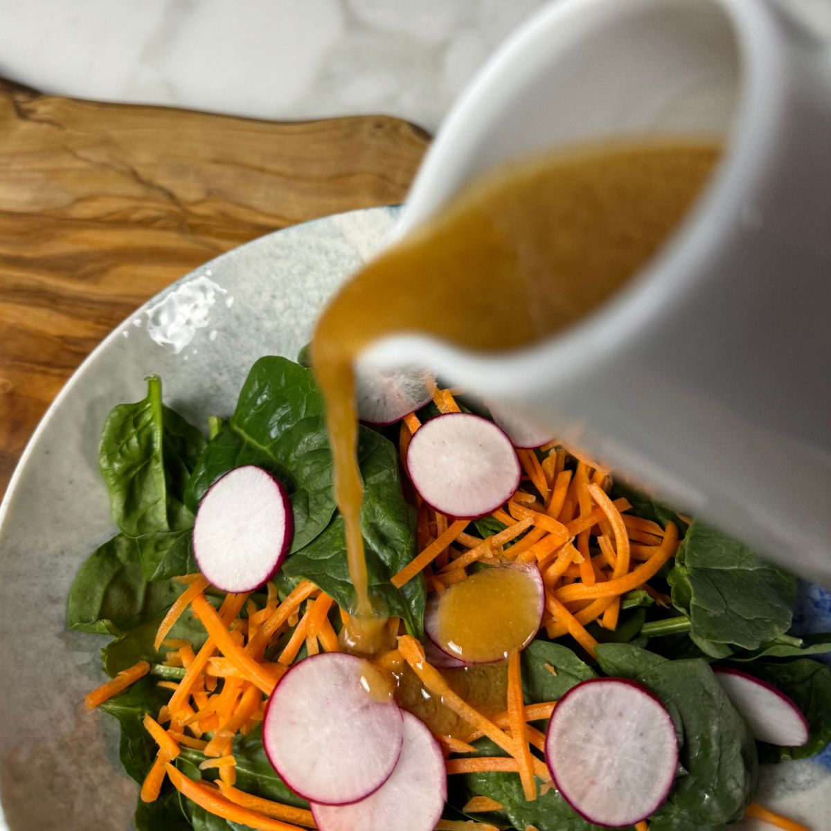 Miso Sesame Dressing poured on salad