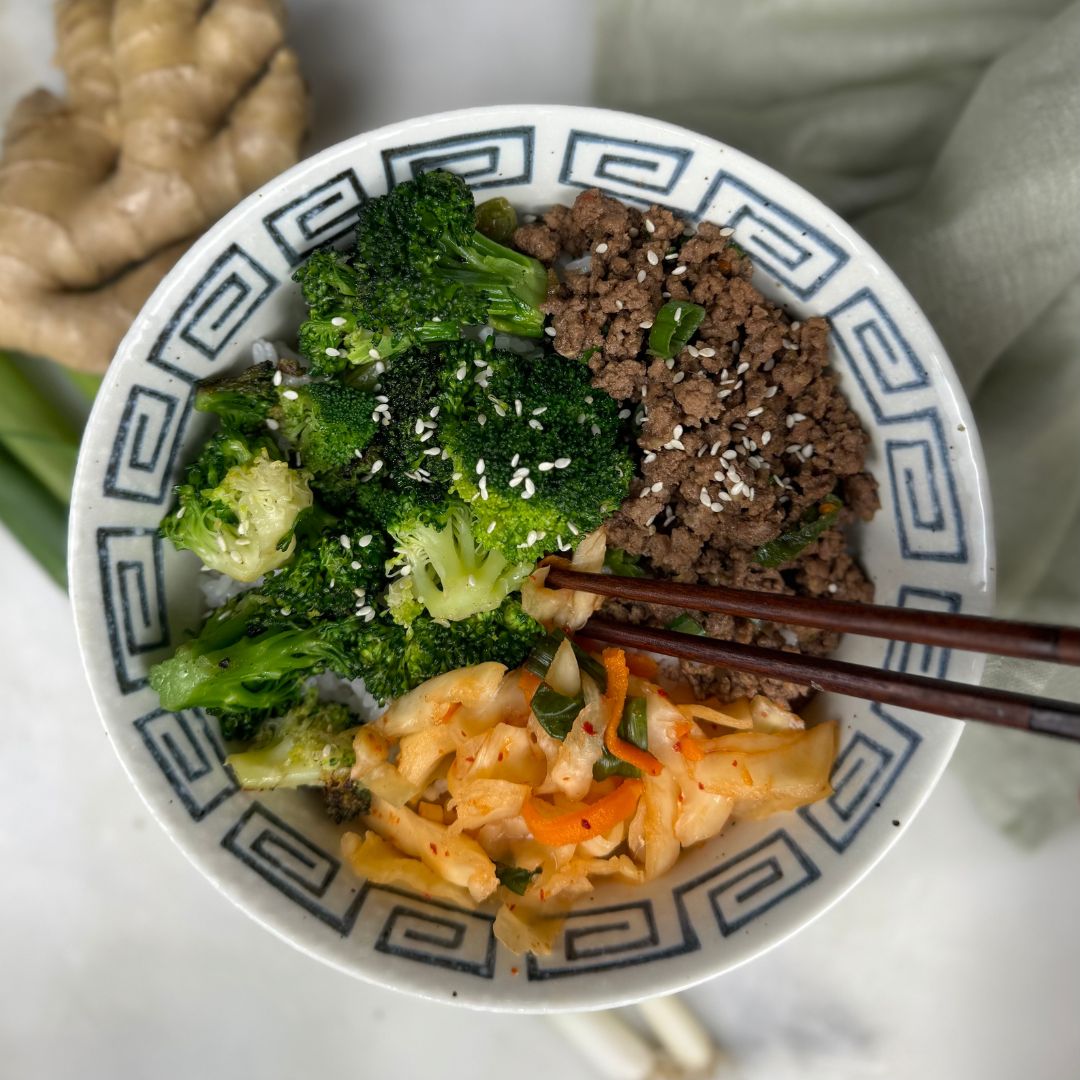 Korean Bison bowl with broccoli and kimchi over white rice