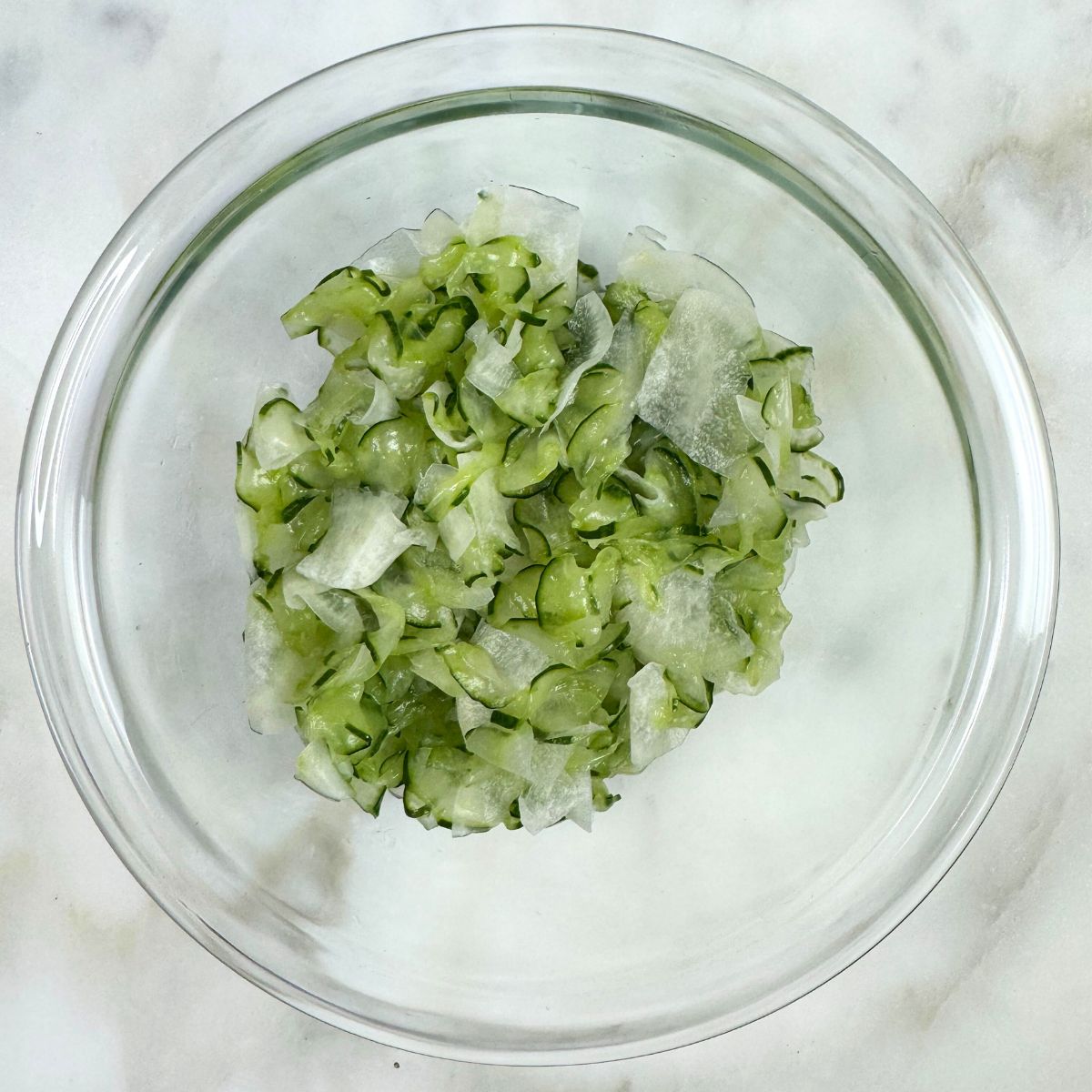 Cucumber and Daikon Sunomono Salad in mixing bowl